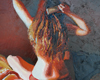 WOMAN COMBING HER HAIR